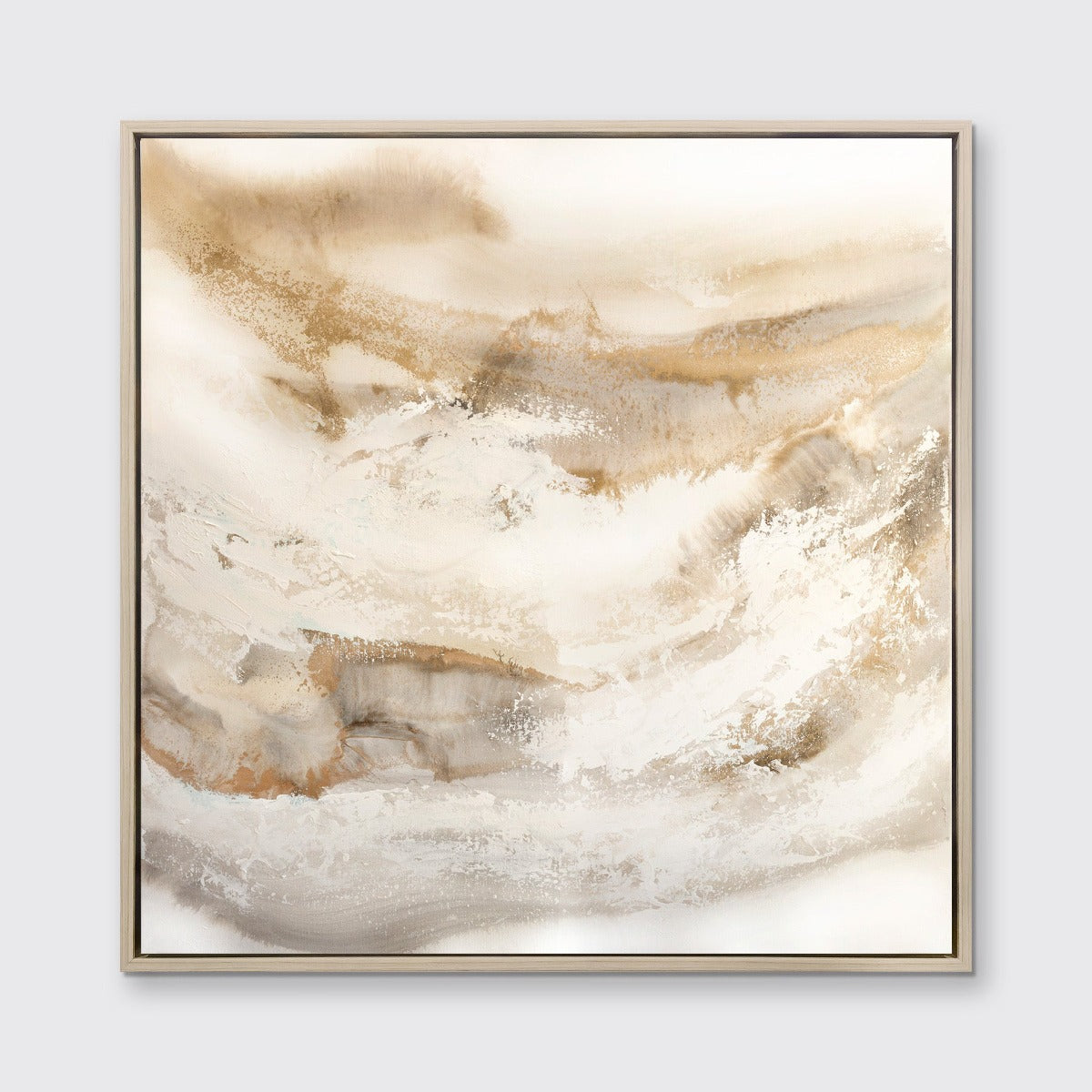 A gold, silver, white and beige abstract print in a white oak floater frame hangs on a white wall.