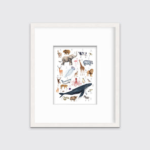 A multicolored print of different animals through the alphabet in a whitewashed frame with a mat hangs on a white wall.