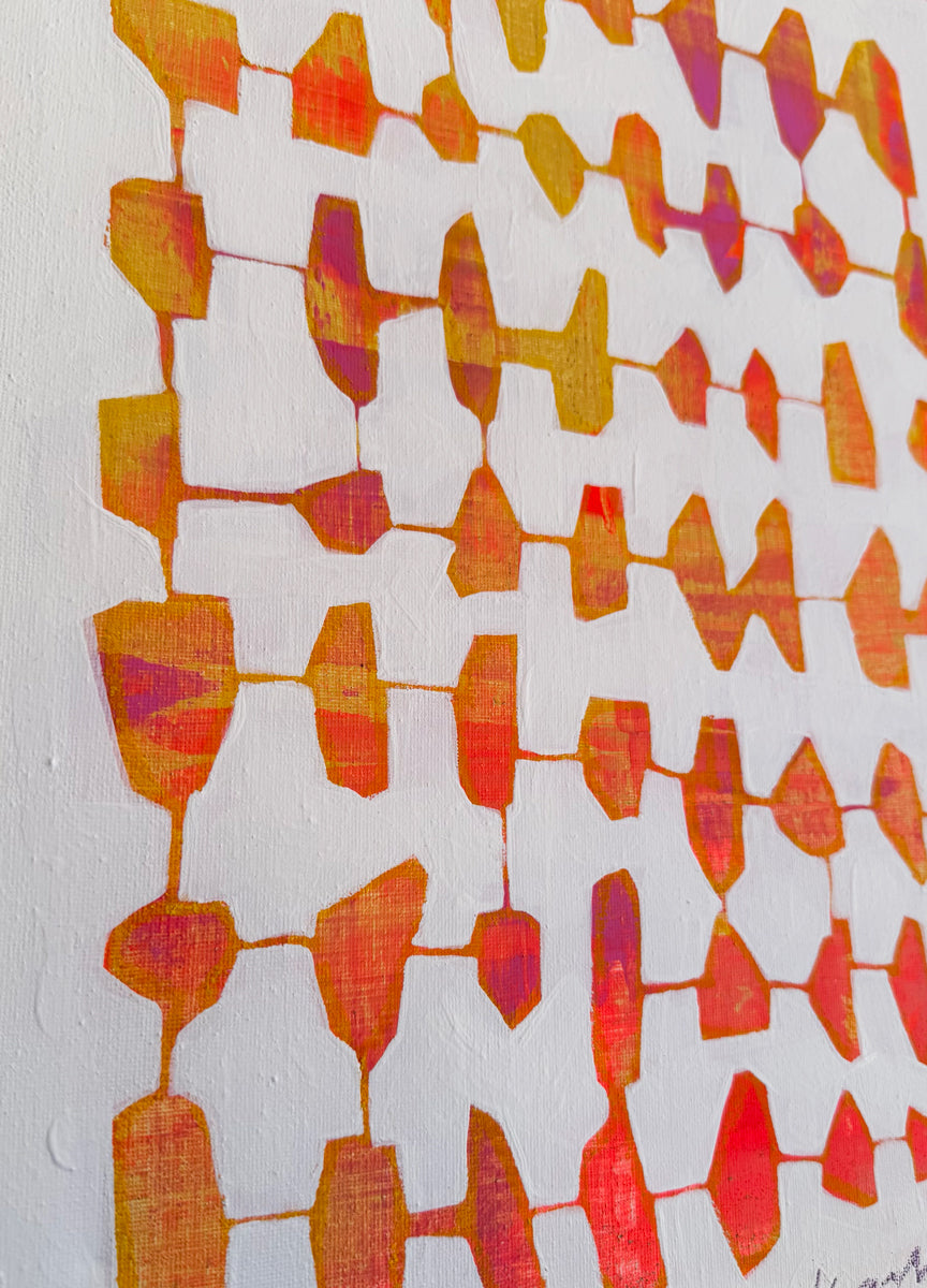 Abstract pattern with orange and red shapes on a white background.