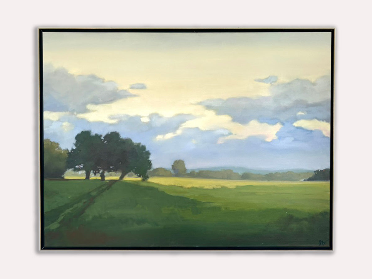 Framed painting of a landscape with trees and a sky.