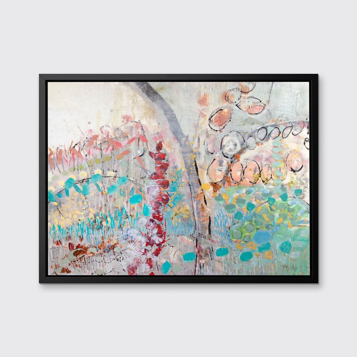 A multicolored abstract floral print in a black floater frame hangs on a white wall.