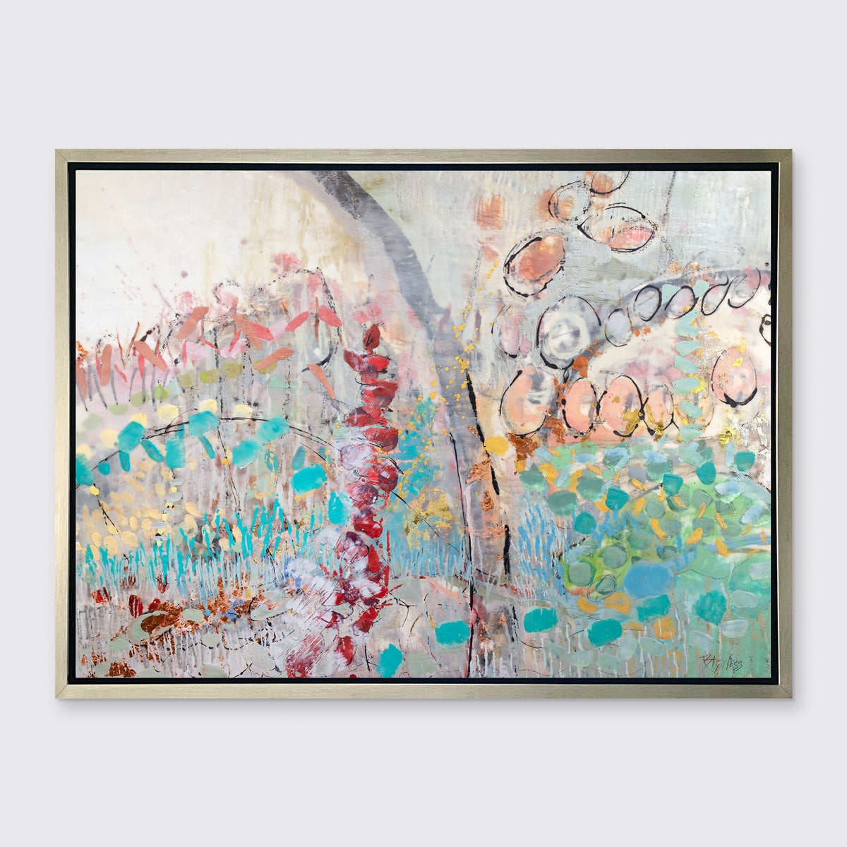 A multicolored abstract floral print in a silver floater frame hangs on a white wall.