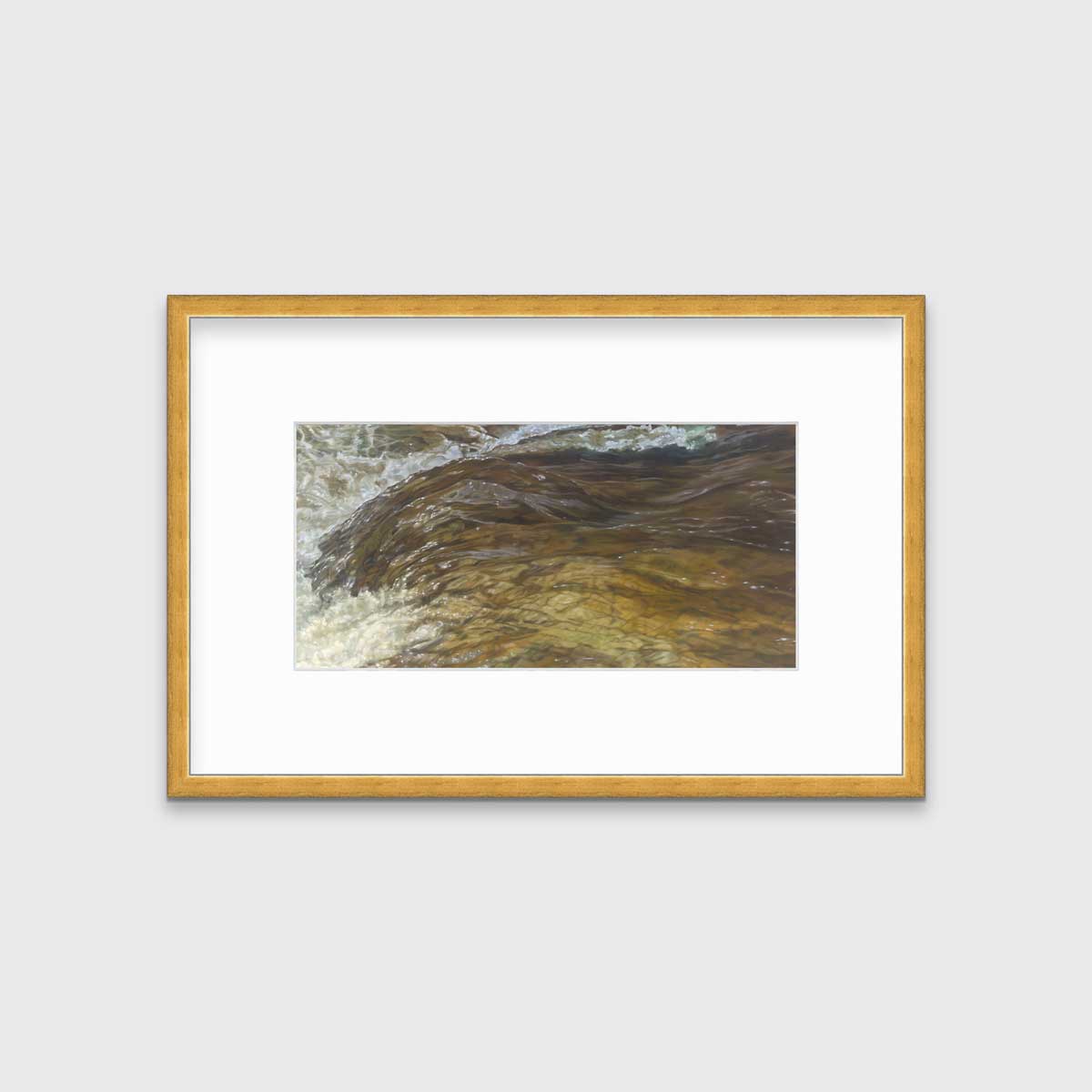 A brown, beige and white abstract river print in a gold frame with a mat hangs on a white wall.