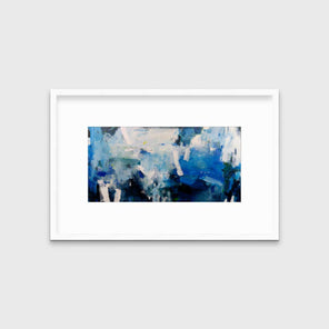A blue and white abstract print in a white frame with a mat hangs on a white wall.
