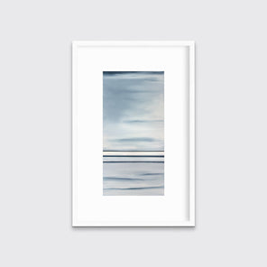 Blue and white abstract print in a white frame with a mat on a white wall.