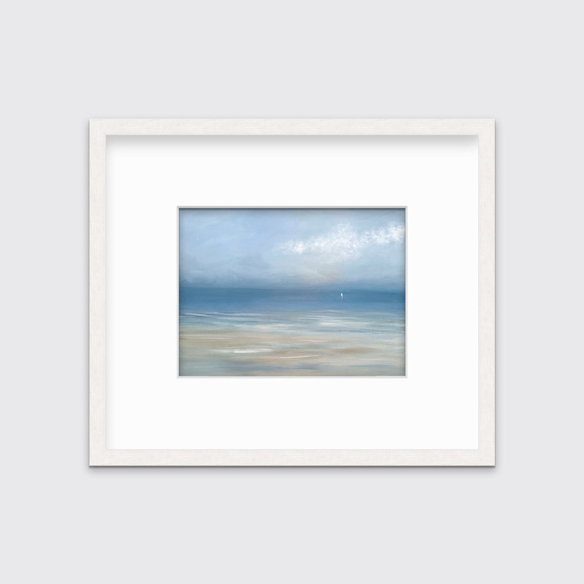 A light blue, white and beige abstract seascape print in a whitewashed frame with a mat hangs on a white wall.