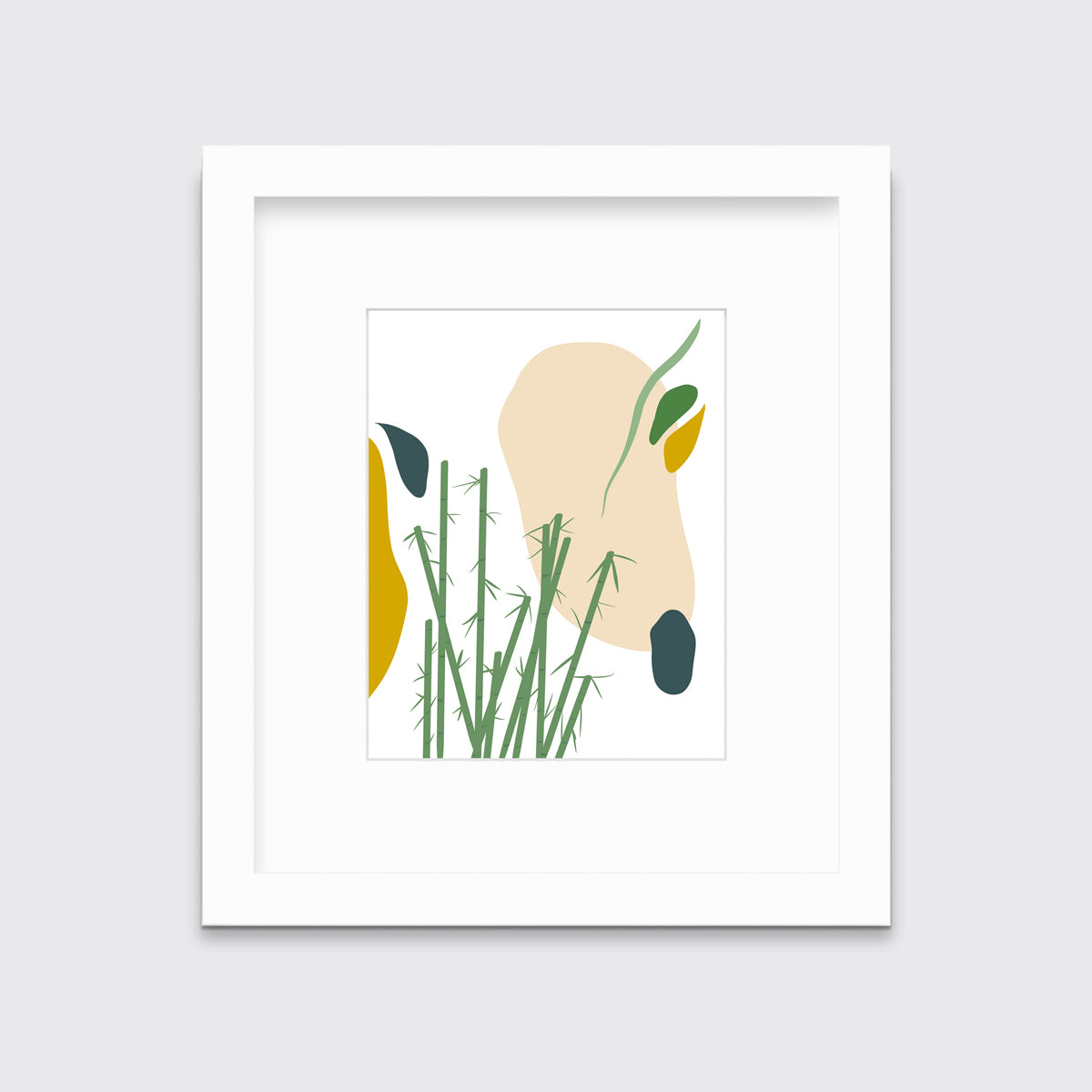 An abstract yellow, beige, blue, and green botanical art print in a white frame with a mat hangs on a white wall.
