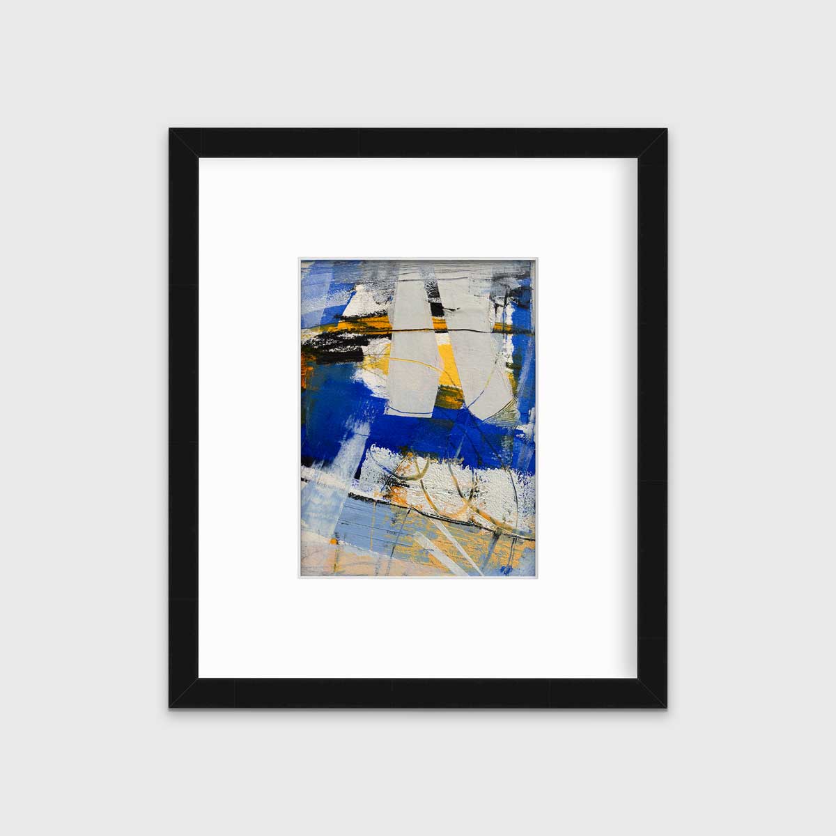 A blue, grey and yellow abstract print in a black frame with a mat hangs on a white wall.