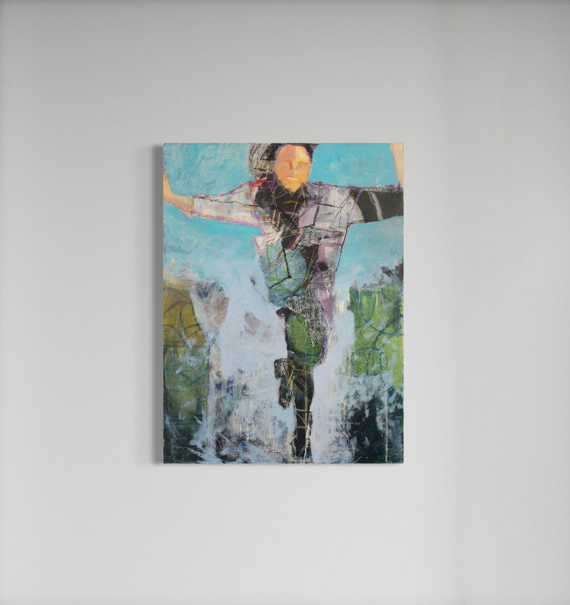 An abstracted figure painting hangs on a white wall.