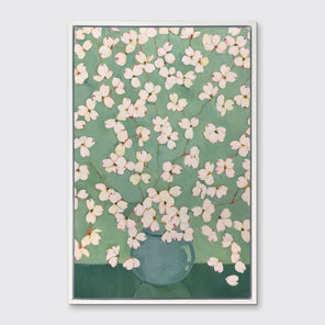 Framed artwork of a vase with white flowers on a green background