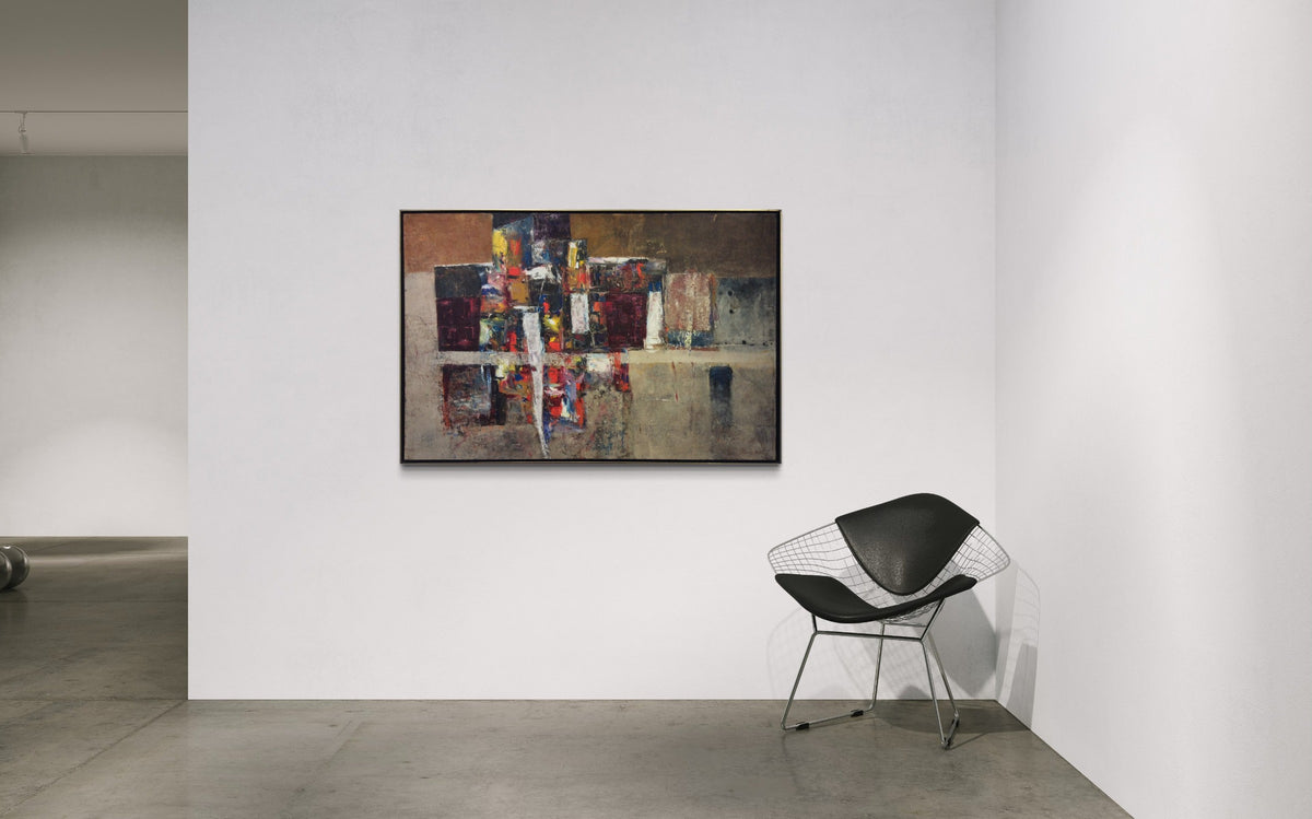 A modern painting by modern artist Stanley Bate is hung on a white wall in the gallery with a black contemporary chair to the right.