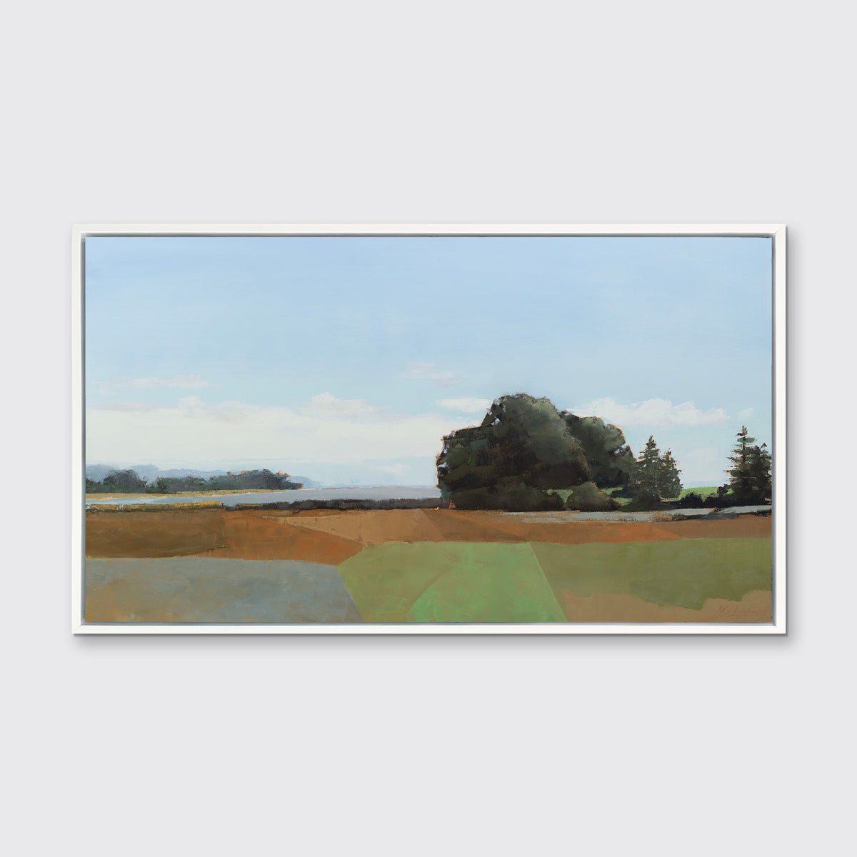 A landscape print in a white floater frame hangs on a white wall.