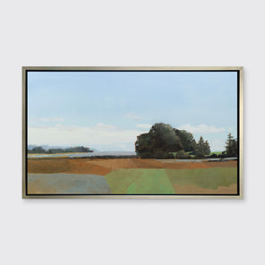 A landscape print in a silver floater frame hangs on a white wall.