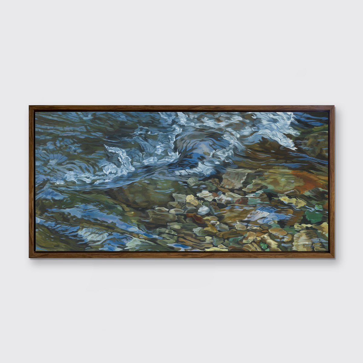 A painting of swirling water in a rocky riverbed hangs in a dark oak frame on a white wall.