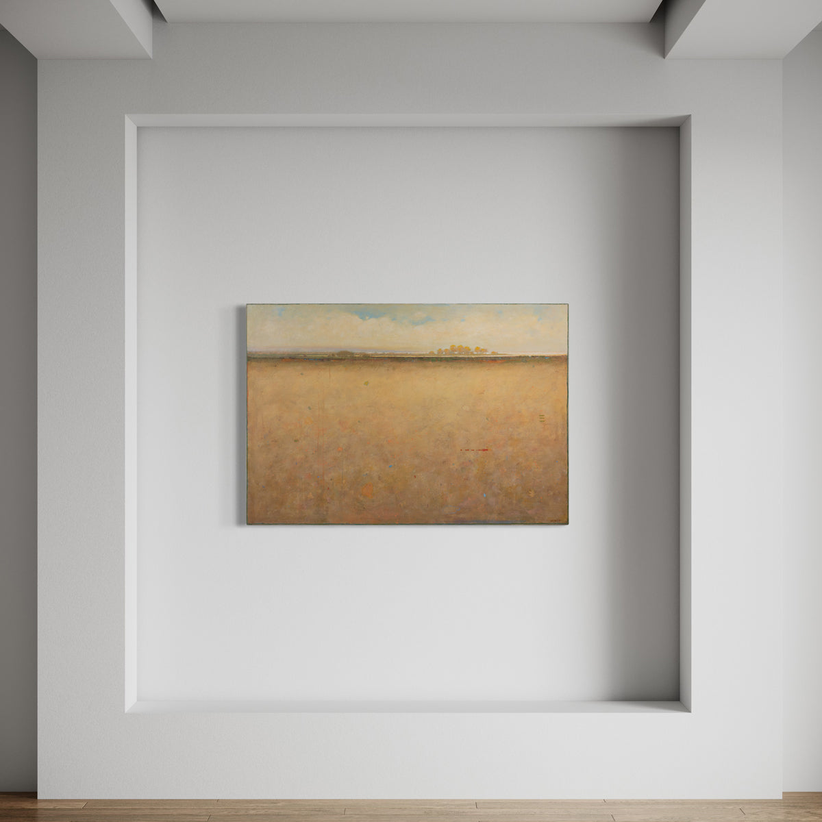 A beige and blue abstract landscape painting hangs on a white wall.