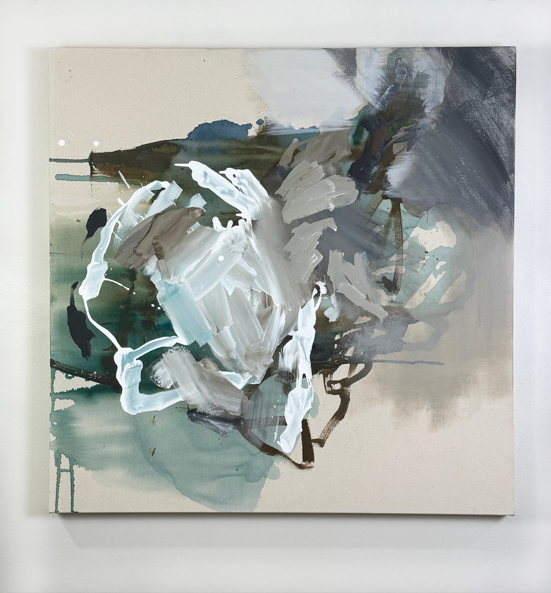 Abstract painting with a mix of white, gray, and green on a beige background