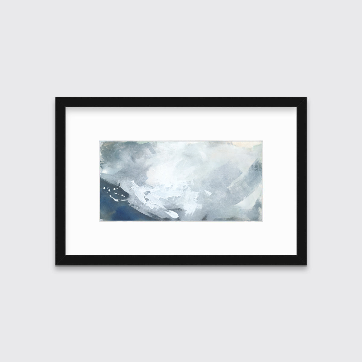A blue, grey and white abstract print in a black frame with a mat hangs on a white wall.