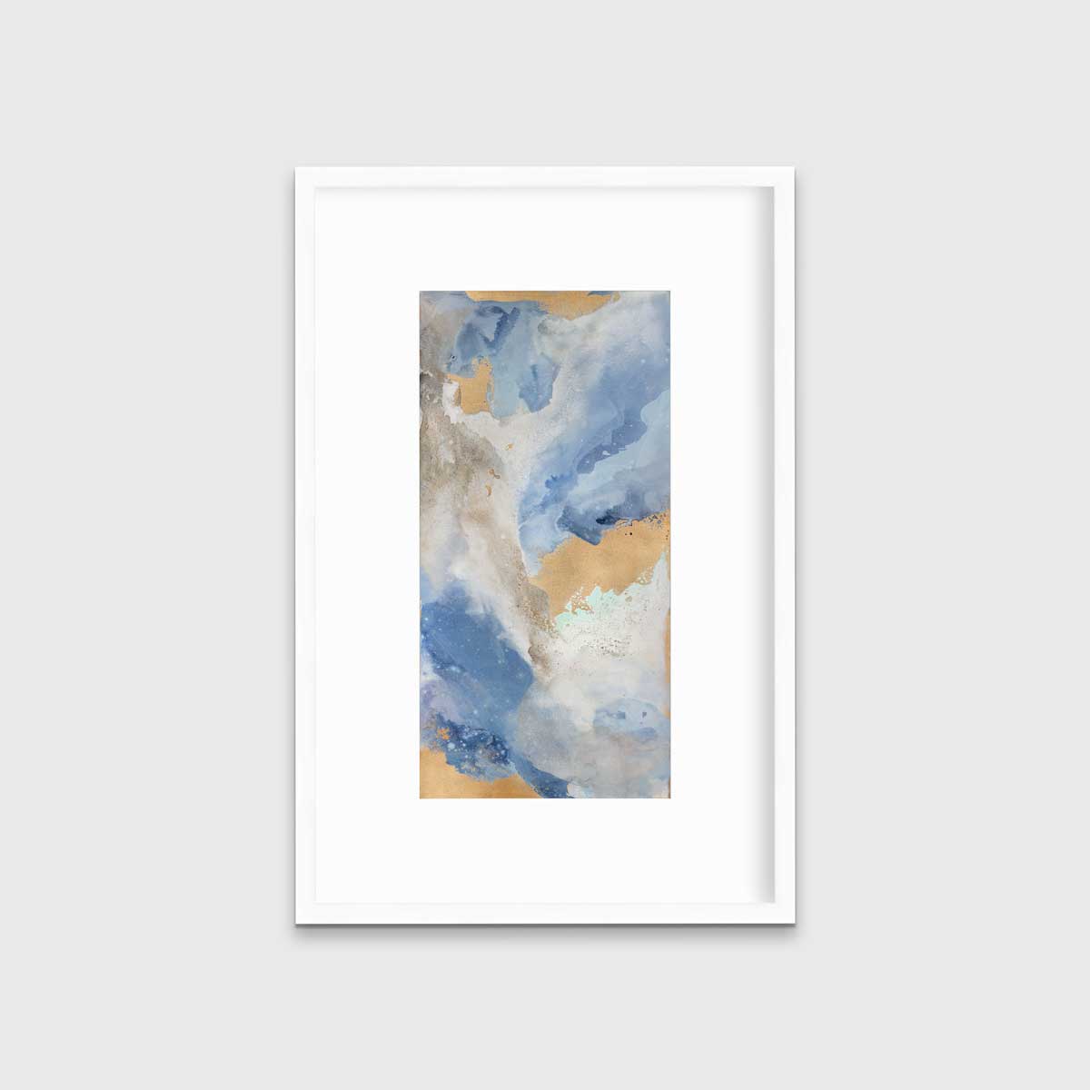 A blue, teal, beige and gold abstract print in a white frame with a mat hangs on a white wall.