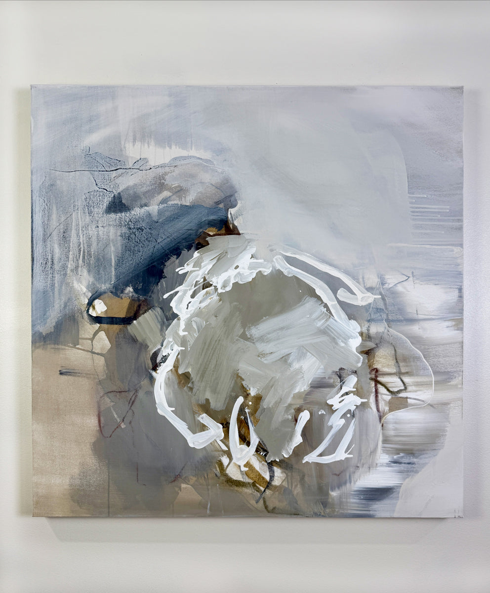 Abstract painting with a mix of white, gray, and beige tones on a white wall.