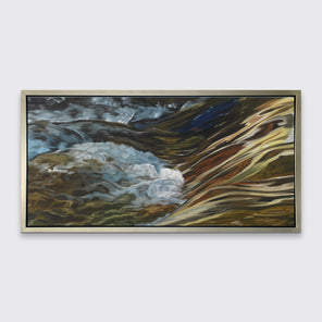 A painting of bubbling water flowing in a rocky river in a silver frame hangs on a white wall.