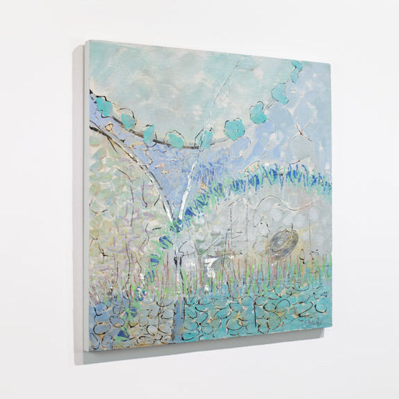 A blue and turquoise abstract painting hangs on a white wall.