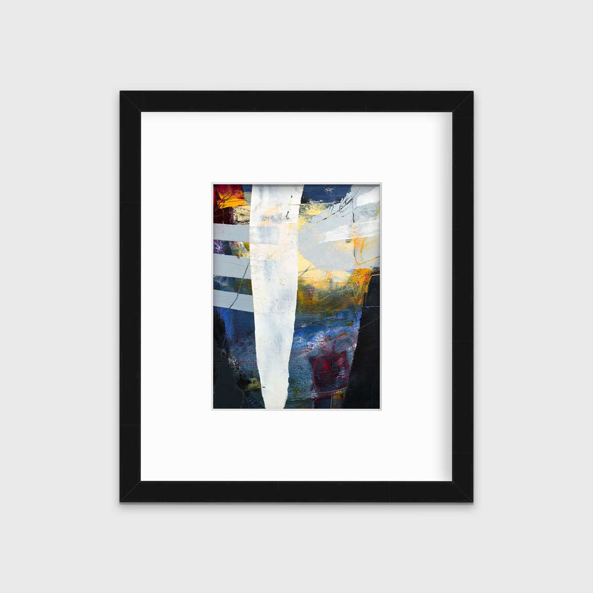 A white, yellow, red and grey abstract print in a black frame with a mat hangs on a white wall.