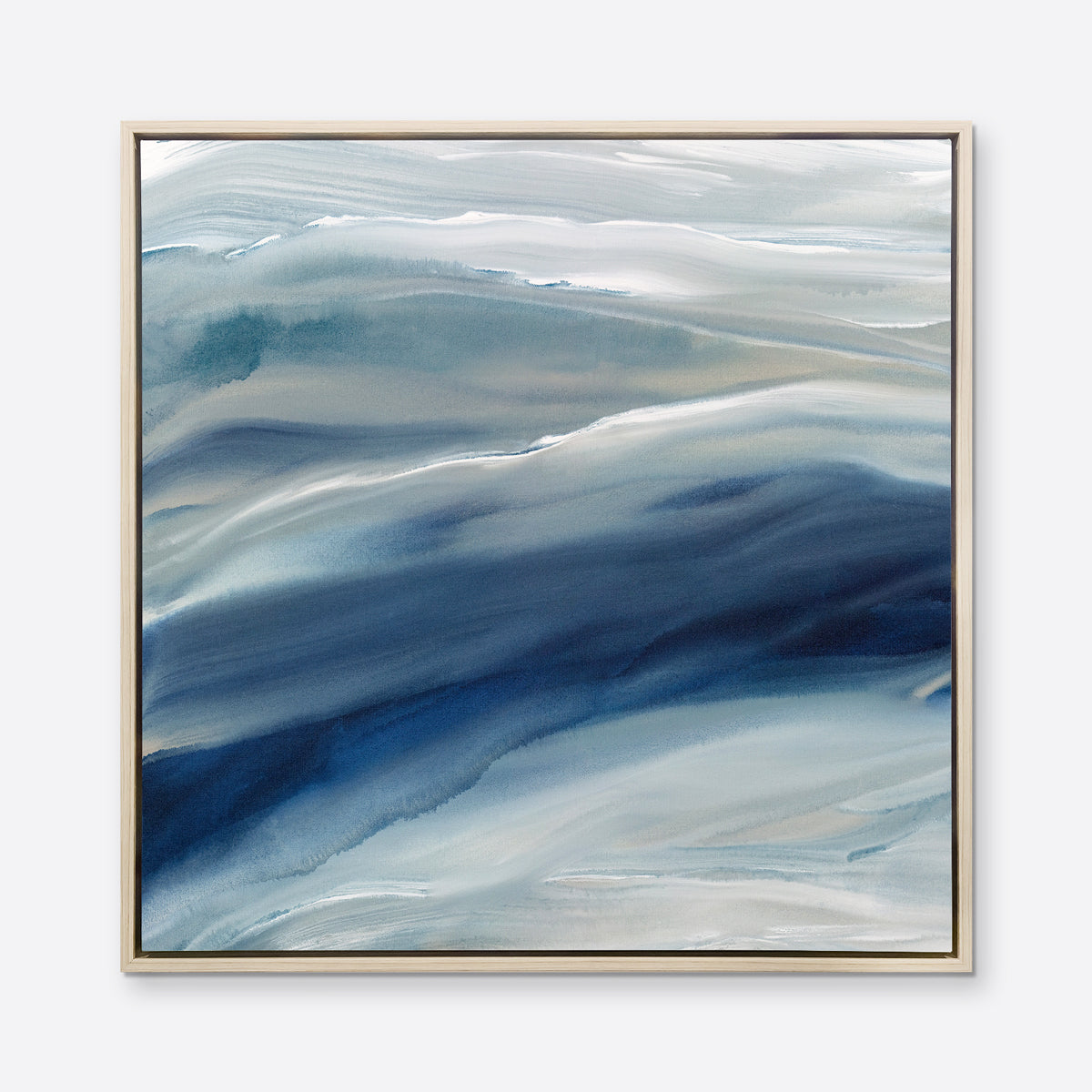 A blue, teal, beige and white abstract print in a white oak wood floater frame hangs on a white wall.