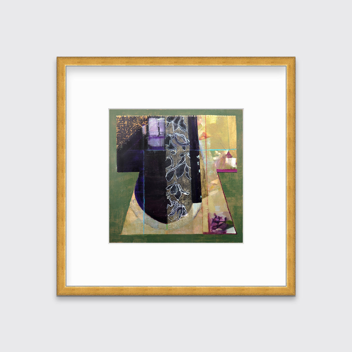 A green, gold and black abstract print in a gold frame with a mat hangs on a white wall.