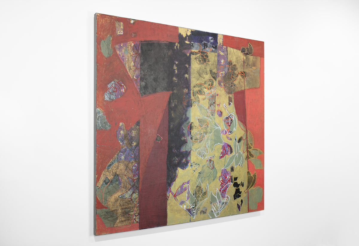 A red and gold abstract painting hangs on a white wall.