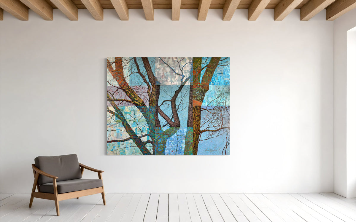 Abstract artwork of trees on a white wall with a wooden chair below.