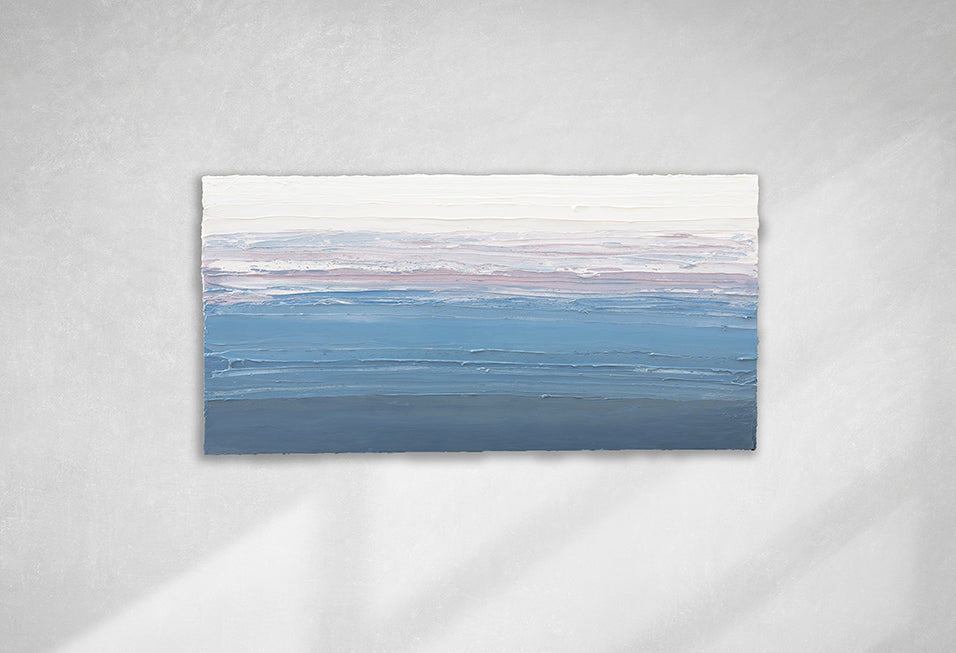 A blue, lavender and white thickly textured abstract painting hanging on a white wall in natural light by Teodora Guererra.
