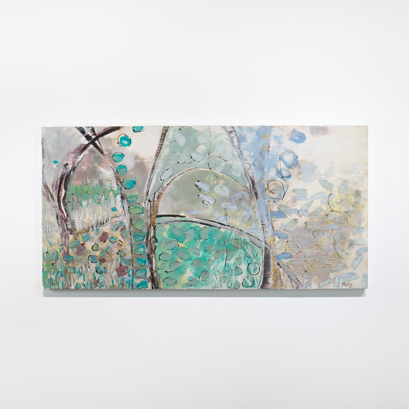 A blue, beige, and turquoise abstract painting hangs on a white wall.