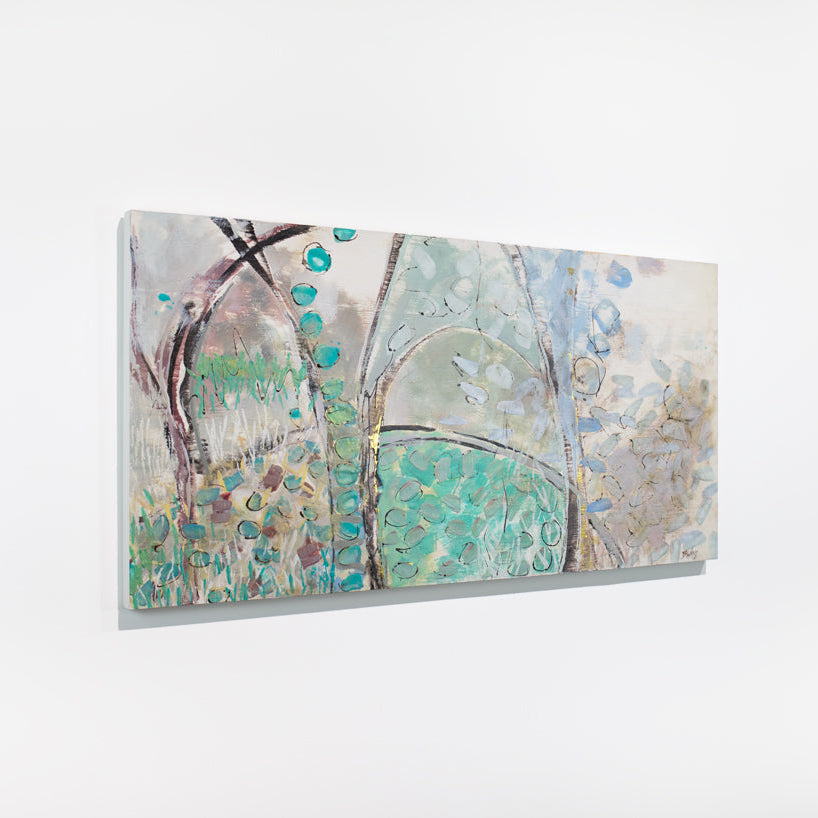 A blue, beige, and turquoise abstract painting hangs on a white wall.