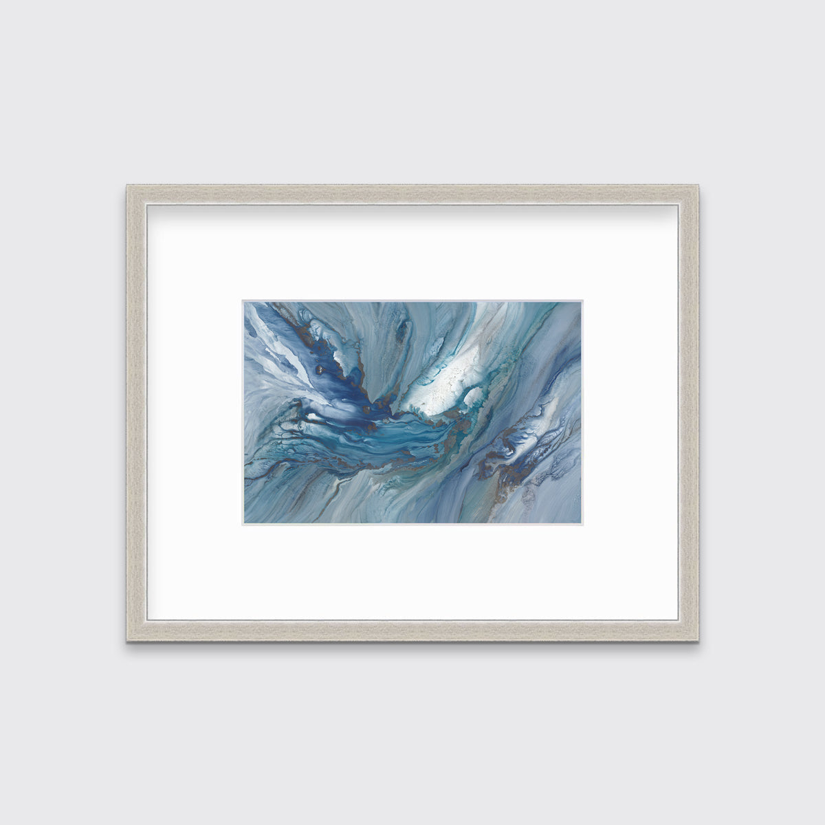 A blue, teal and white abstract print in a silver frame with a mat hangs on white wall.