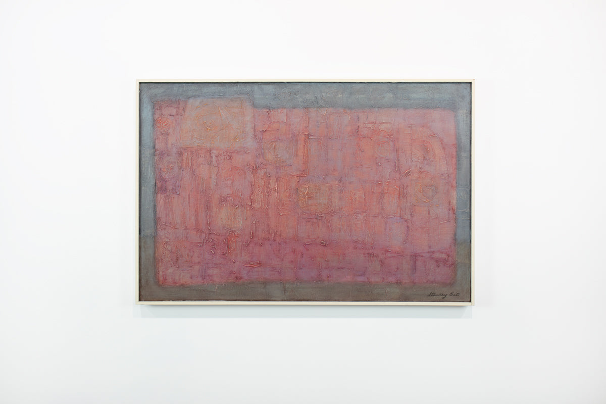 A framed red and grey abstract painting hangs on a white wall.