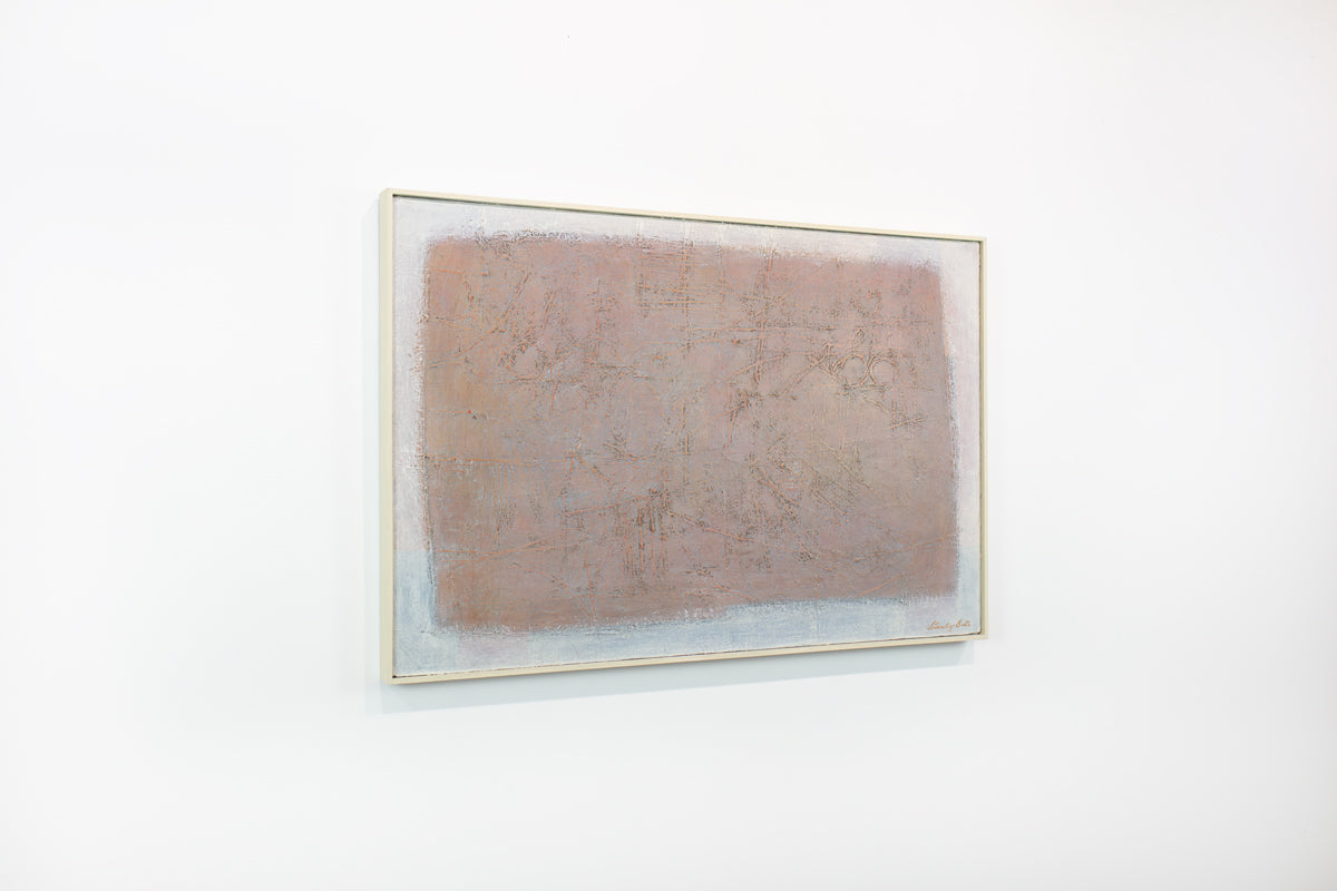 A framed white and light link abstract painting hangs on a white wall.