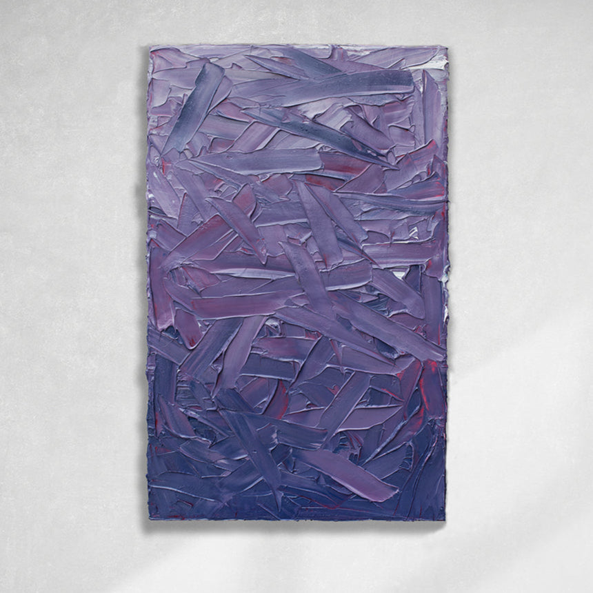 A tonal purple and pink thickly textured abstract painting by Teodora Guererra hangs on a white wall.