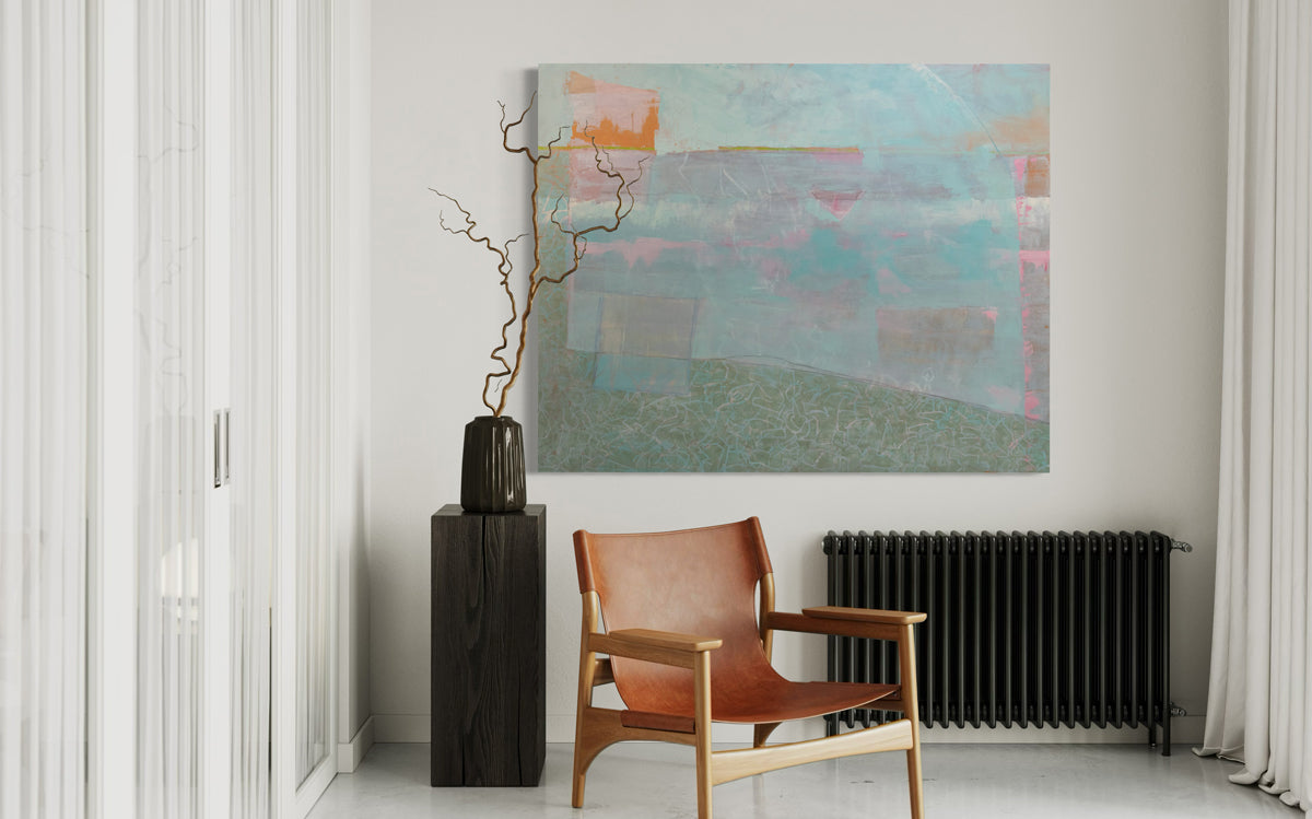 An abstract painting by Christine Averill-Green is hung above a black radiator with a leather chair sitting in front.