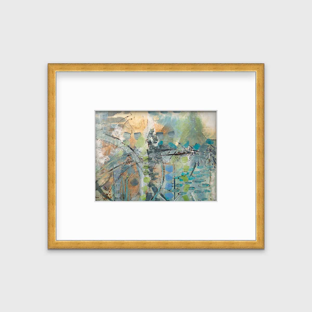 A blue, green, orange and black abstract print in a gold frame with a mat hangs on a white wall.