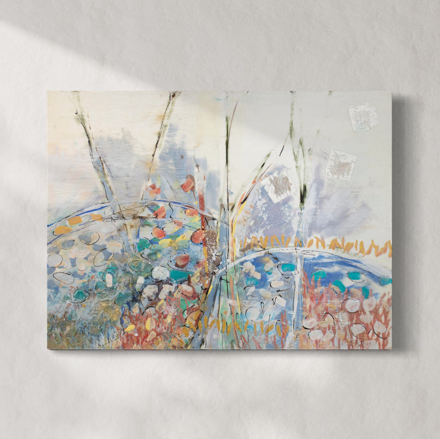 A multicolored abstract painting hangs on a white wall.