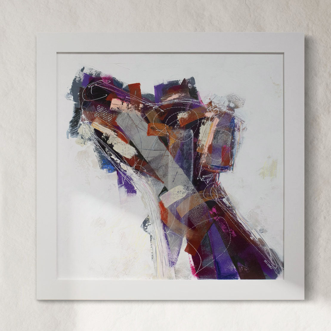 Framed original abstract painting of a dog hanging on a wall.