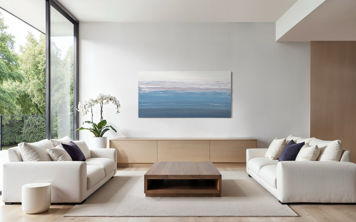 Modern living room featuring a large original abstract painting by Teo Guererra on the wall, white sofa, wooden coffee table, and potted plant.