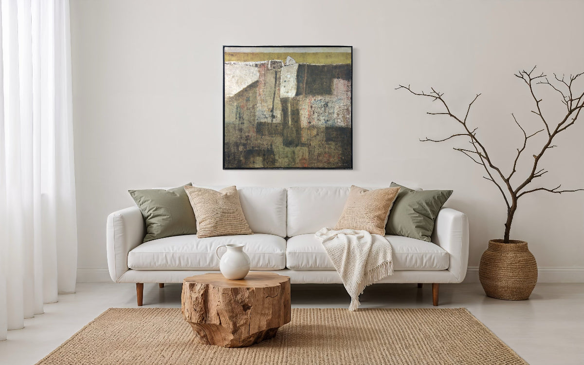 Living room with a white sofa, wooden coffee table, and abstract painting on the wall.