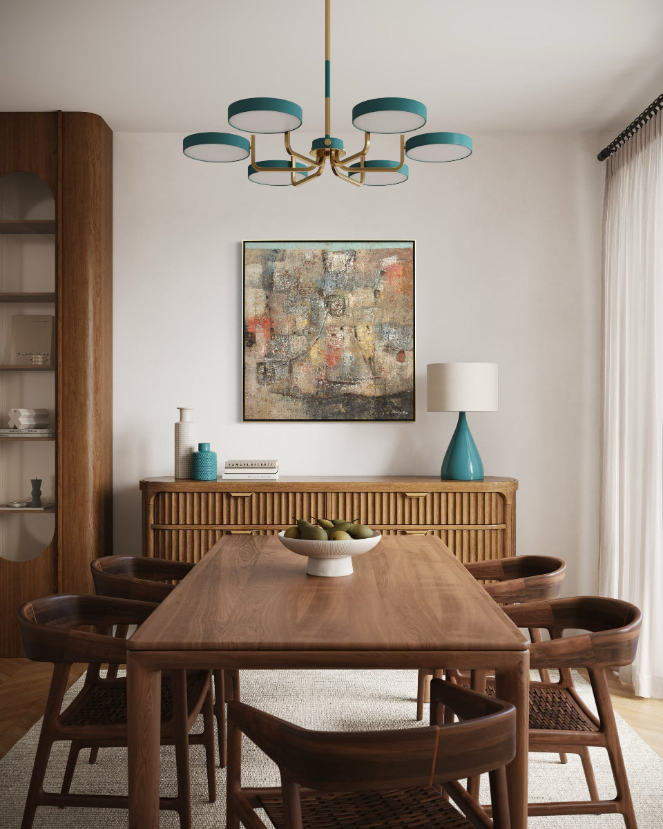Dining room with wooden table and chairs, chandelier, and wall art.