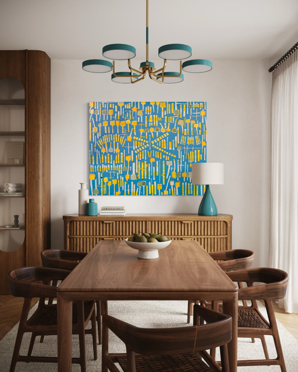 Dining room with wooden table and chairs, blue abstract painting, and modern chandelier.