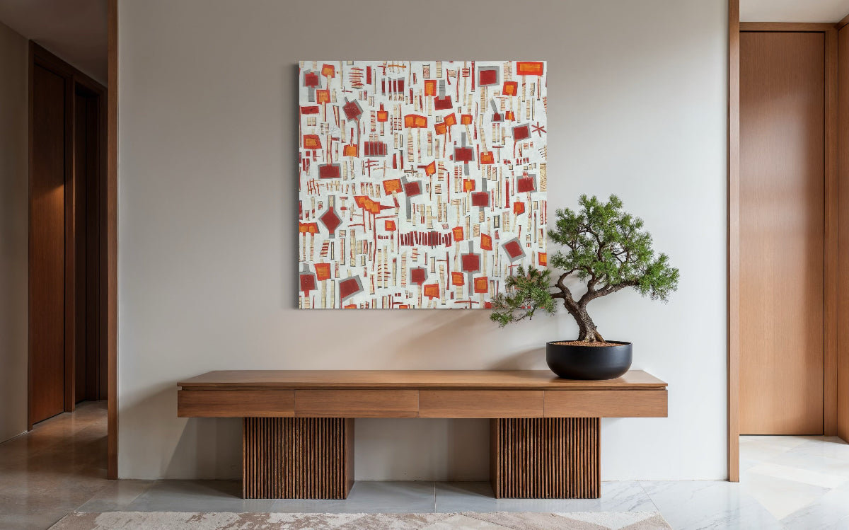 Modern interior with a wooden bench, patterned wall art, and bonsai tree.