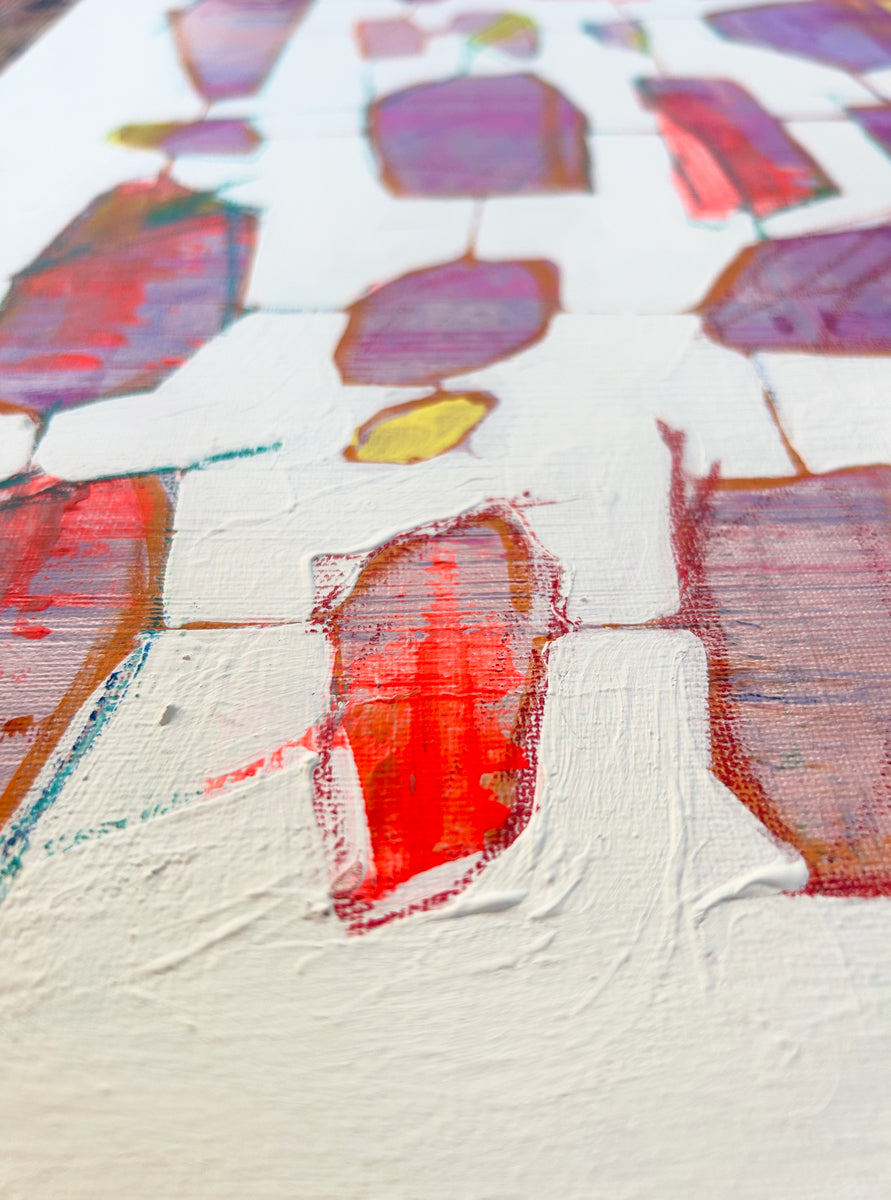 Abstract art with colorful brush strokes on a textured surface.
