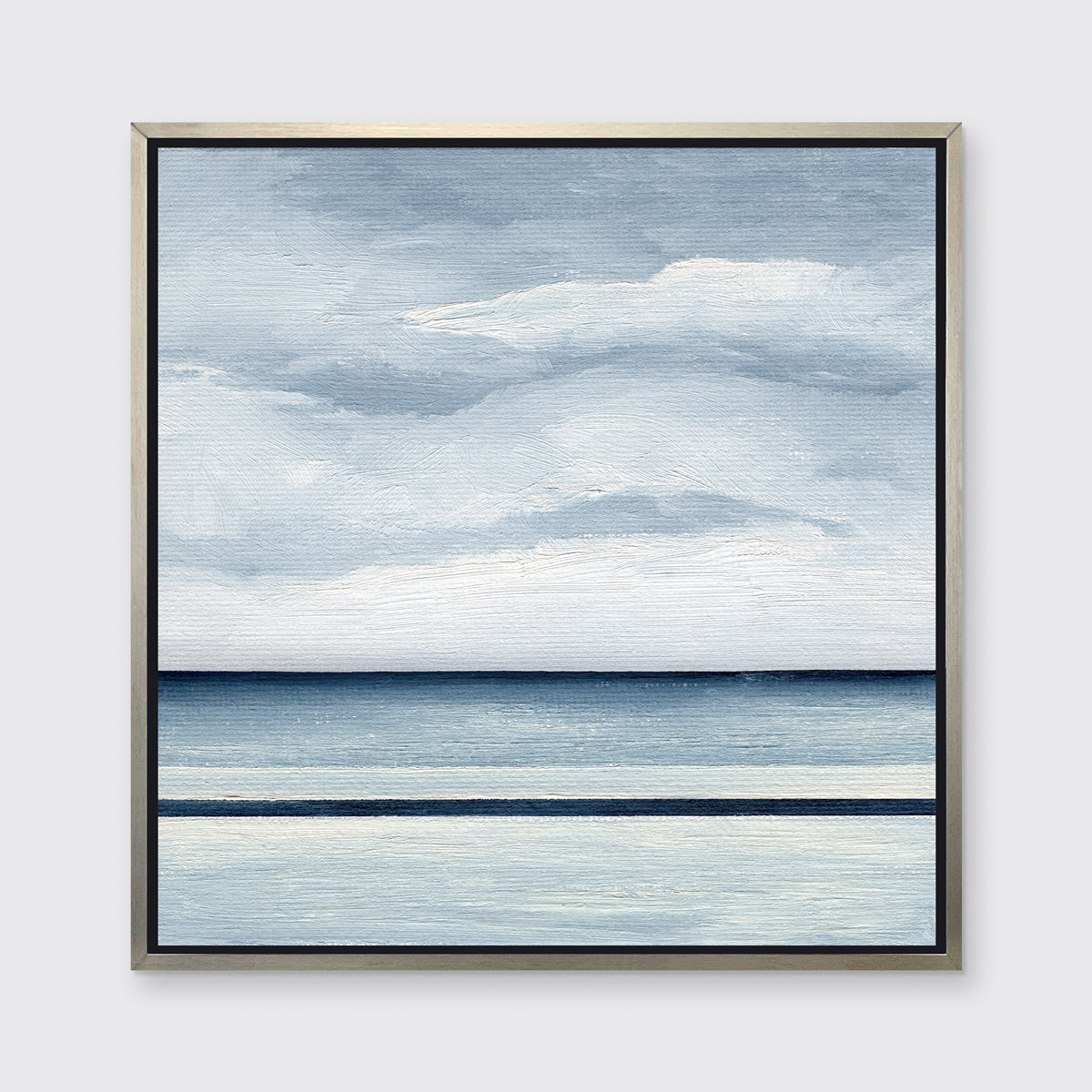 A blue and white abstract linear landscape in a silver floater frame hangs on a white wall.
