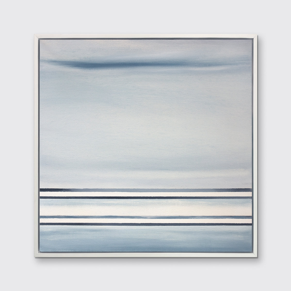 A blue and white linear abstract print in a white floater frame on a white wall.