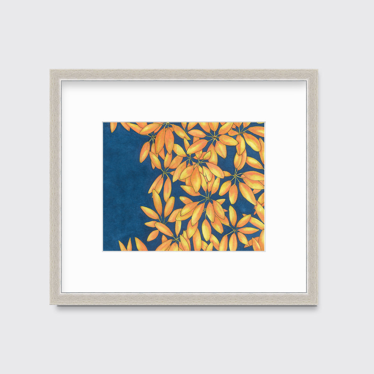 A blue, yellow and orange plant print in a silver frame with a mat hangs on a white wall.